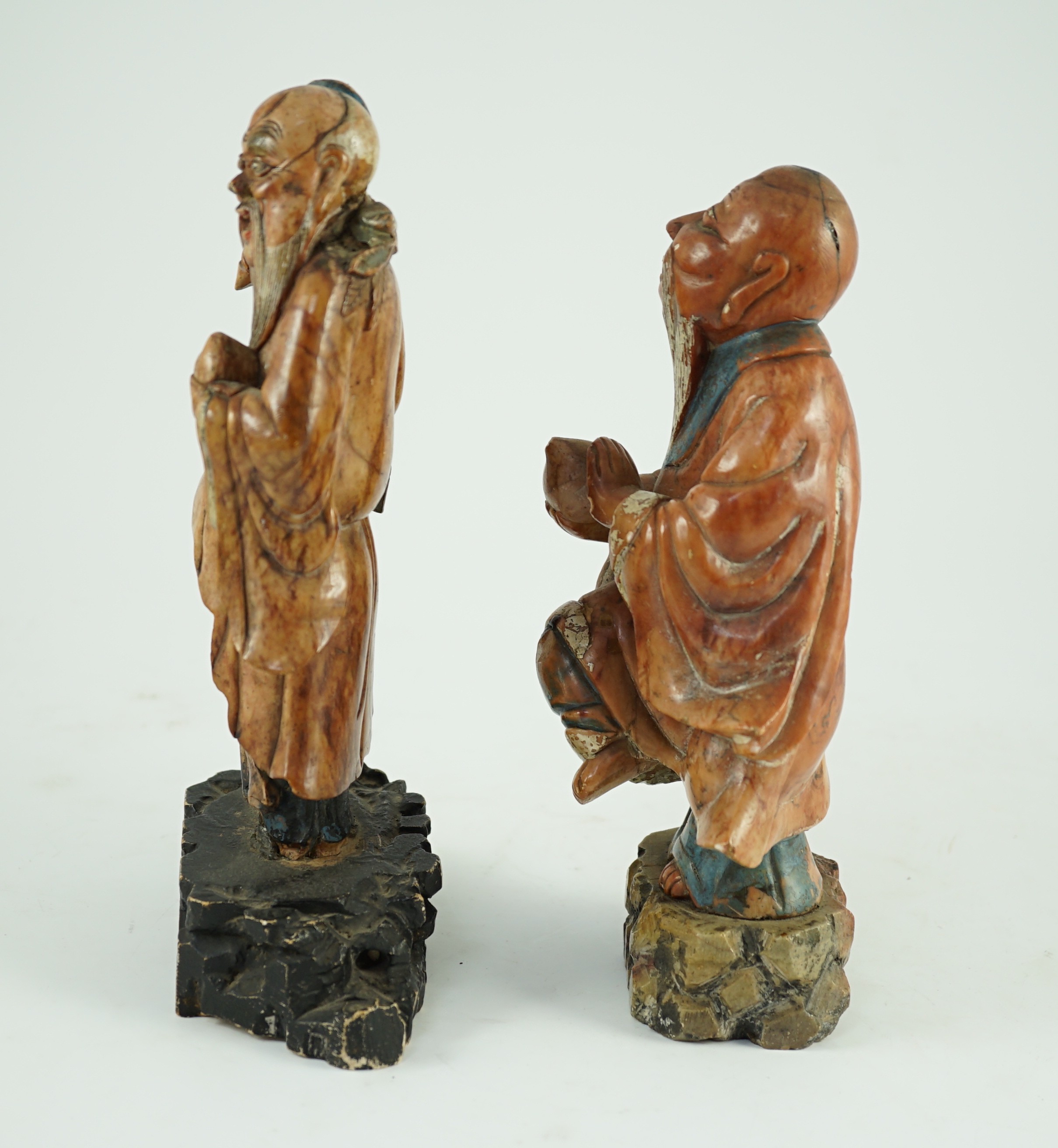 Two Chinese soapstone figures of Shou Lao, 18th century, 23cm and 24.5cm high